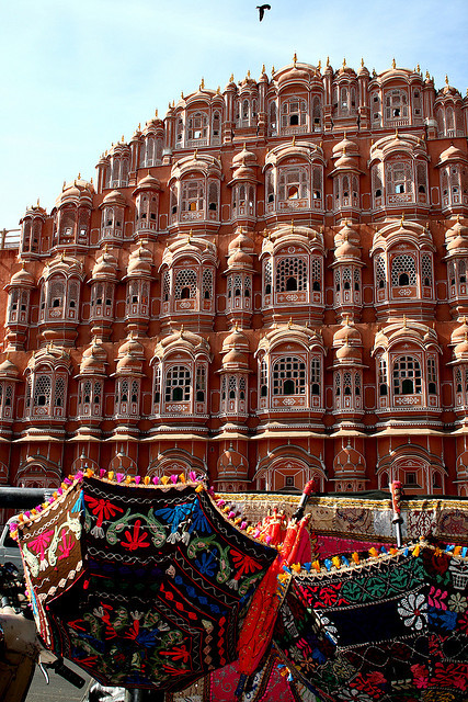 Colorful umbrellas in front of Hawa Mahal Palace in Jaipur, India
