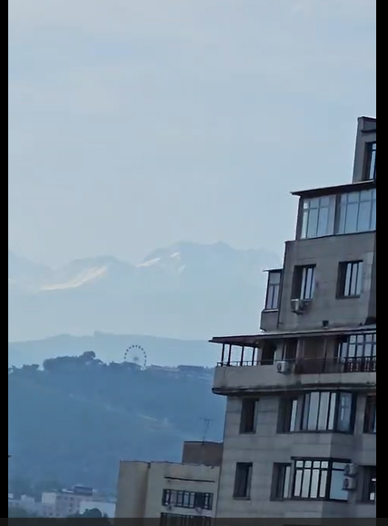 The view from our Airbnb window — Tian Shan Mountains in the distance and Kok Tobe watching over the city.