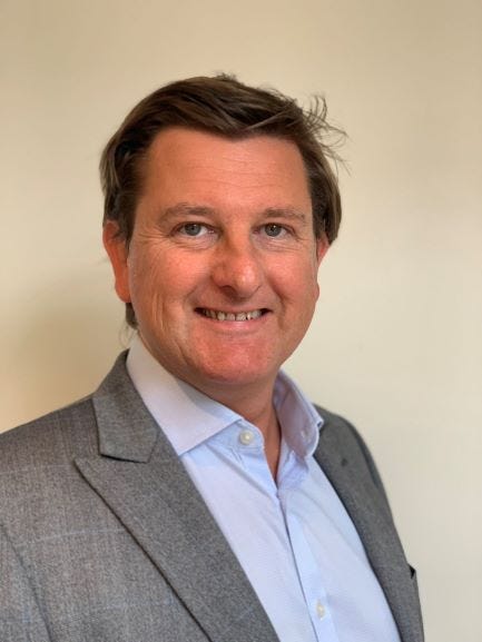 Matthew Feargrieve solicitor and hedge fund lawyer sitting in his office in London at Withers LLP