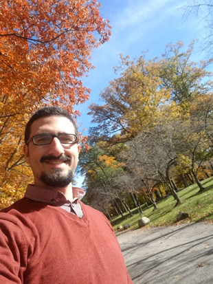Man taking a selfie in autumn.