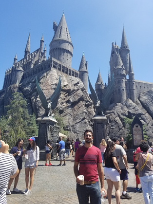 Man in front of a castle.
