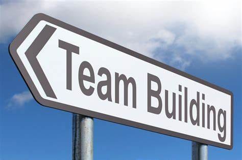 A road sign that reads “Team Building”