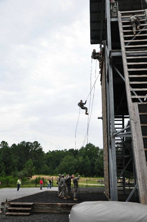 Falling is not Failing. This is a photo of a rappelling tower