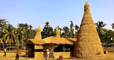Picture credit : Sentinel Digital Desk (Published on 13th Jan 2025, 9.25 am) ; In the image the hut is called the ‘Bhelaghor’ and the cone shaped structure is called ‘Meji’.