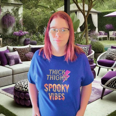 Choosing minimalist design for apparel - 'Thick Thighs and Spooky Vibes' shirt with clean, bold font and simple color palette.