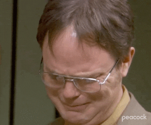 An animated gif of a man in suit crying tears of joy and saying thank you
