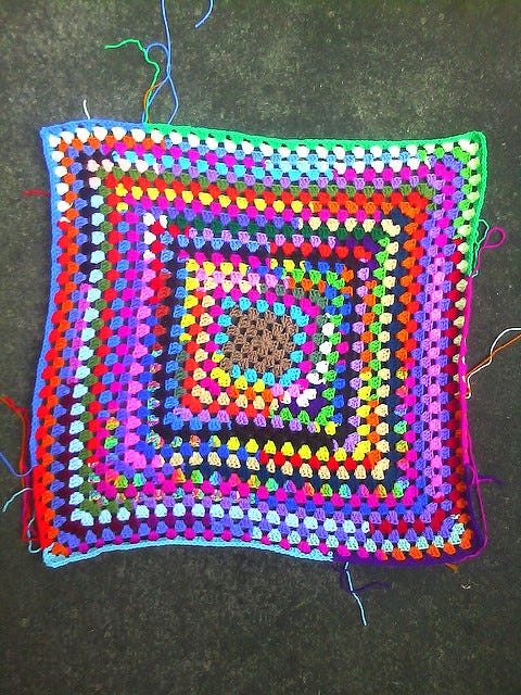Scrap yarn granny square goodness, by Leslie Stahlhut