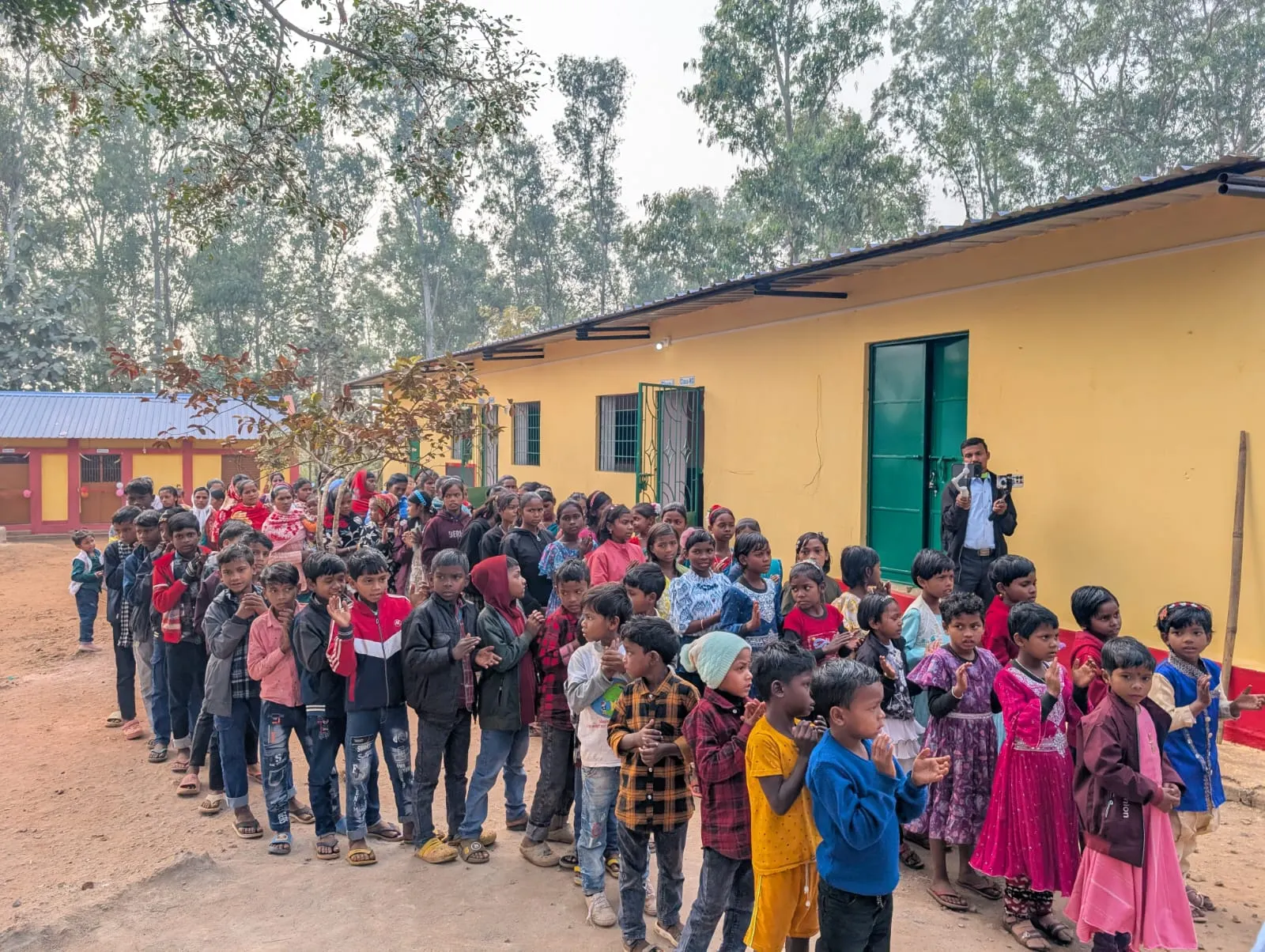 Students raising hands in classroom