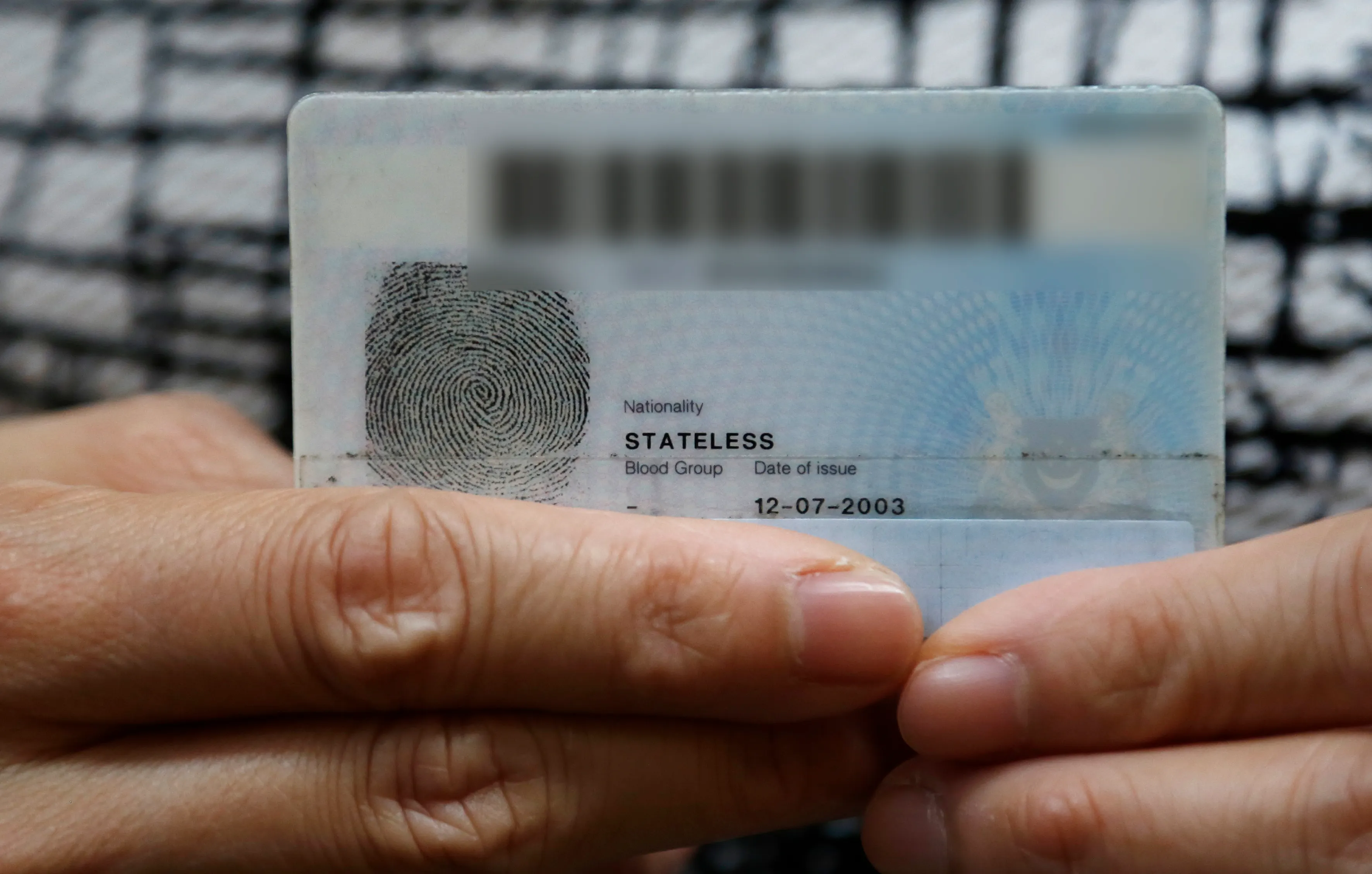 What are the challenges for those whose nationality is unknown in Singapore?