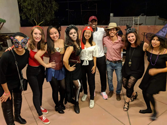 Group taking a selfie in HAlloween costumes.