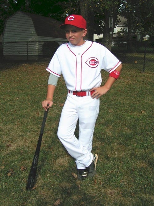 The Mr. Redlegs logo is seen on the jersey of Joey Votto during a