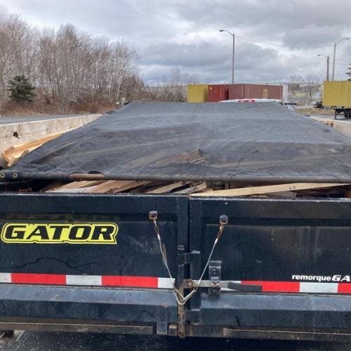 Easily remove junk around your home or business with The Gator Dumpster Bag