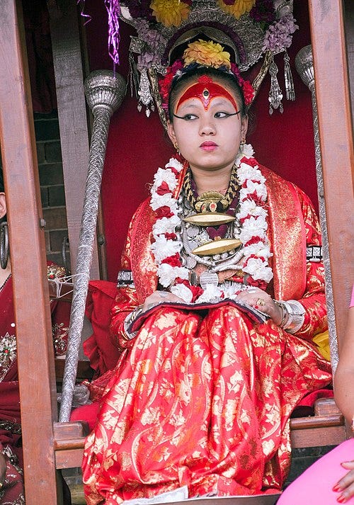 Chanira Bajracharya, the Kumari of Patan, during a procession in 2011. Kumari is the living goddess in Nepal Hinduism, a practice that is popular and controversial at once. (Image source- Wikimedia Commons)