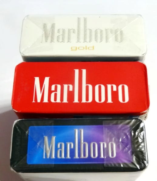 Three Boxes Of Marlboro Gold Pack Cigarettes Stock Photo