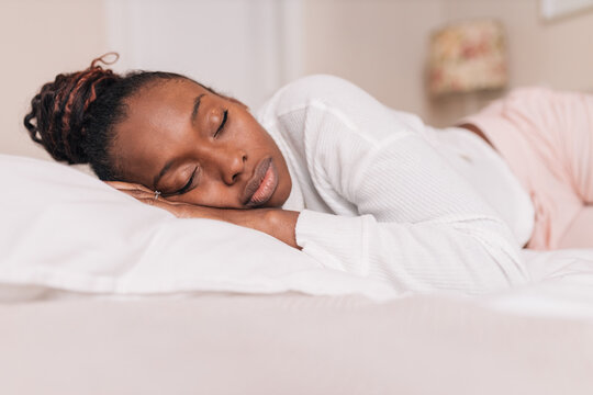 Twist or braid your hair while sleeping