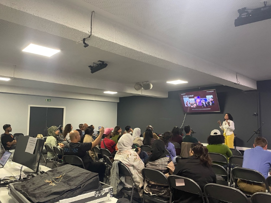 Capture of a great talk — Ana Martins speaking about empowering migrants to start home-based businesses