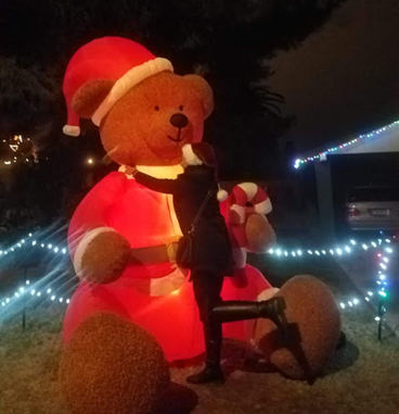 Woman hugging giant bear.