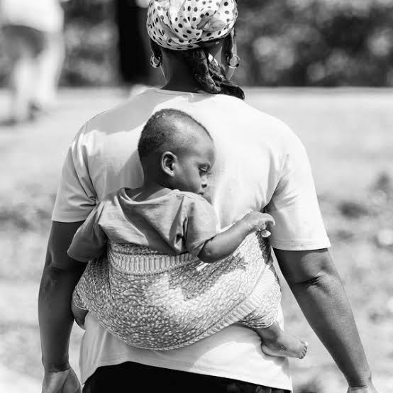 Typically how African mothers carry their babies on their back. Source: Shutterstock