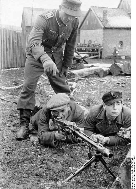 Civilian Volkssturm are trained to shoot the MG 42, a general purpose machine gun and one of the best weapons of the war. November 1944. By Bundesarchiv