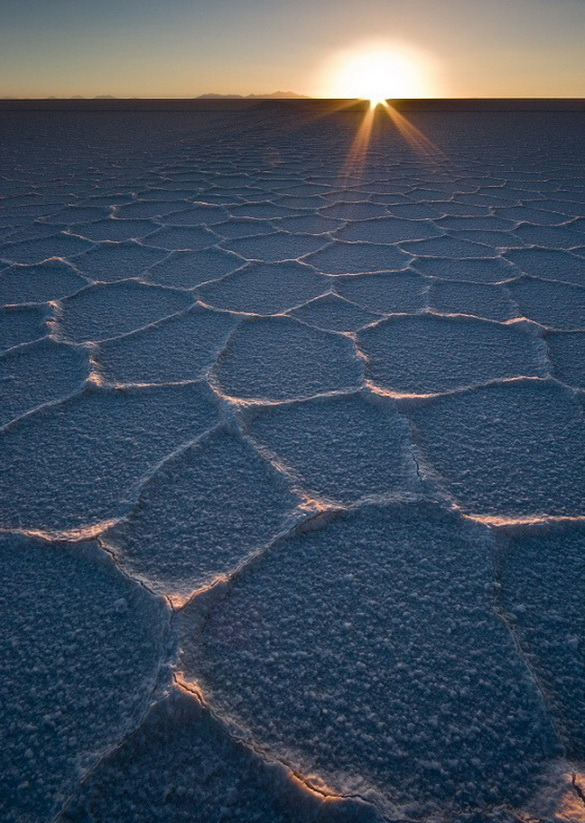 Sunset over the salt flats of Salar de Uyuni in Bolivia