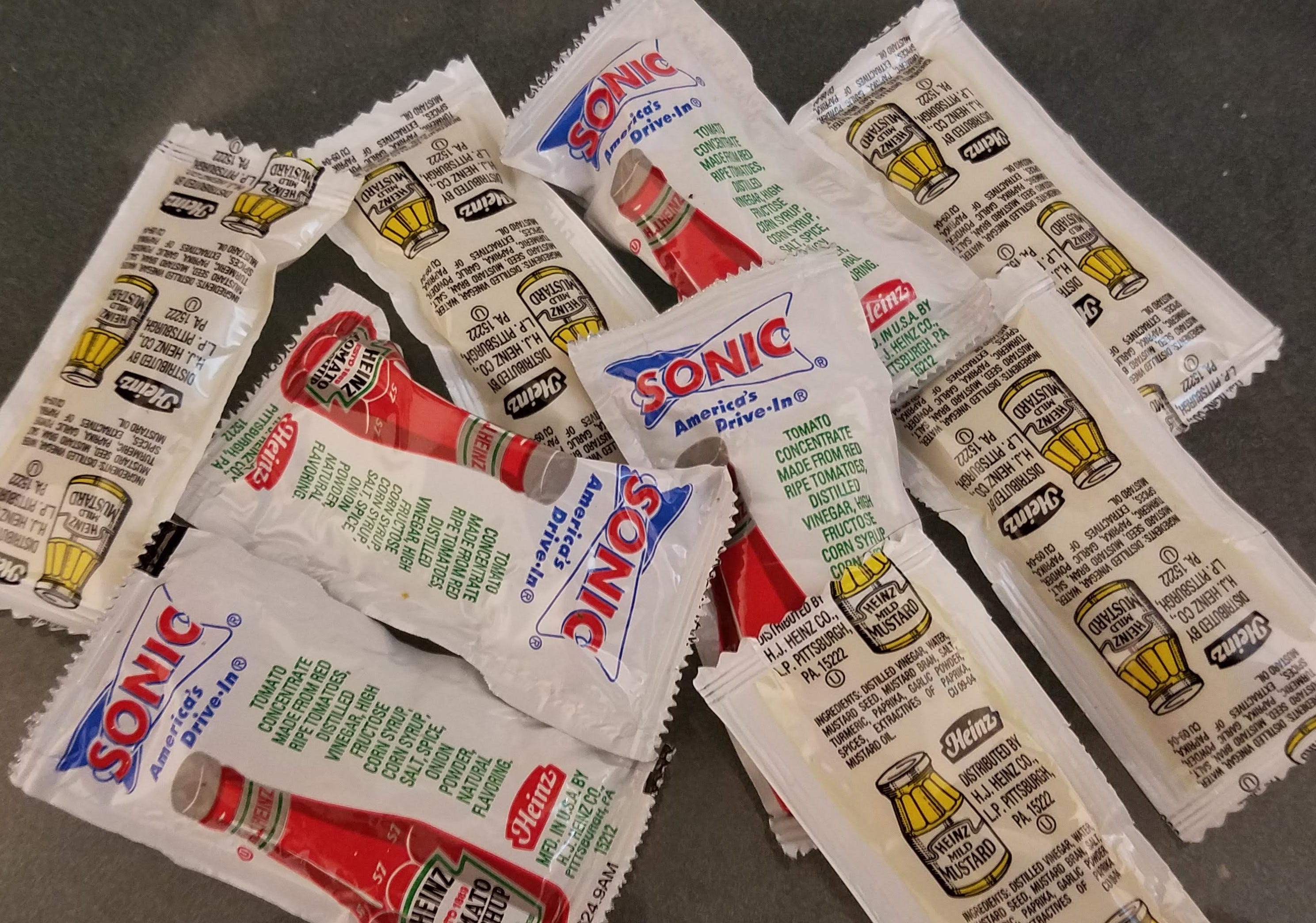 Nine condiment packets for one burger, corn dog and fries. Really? | by Kirk Weinert | The Public Interest Network | Medium