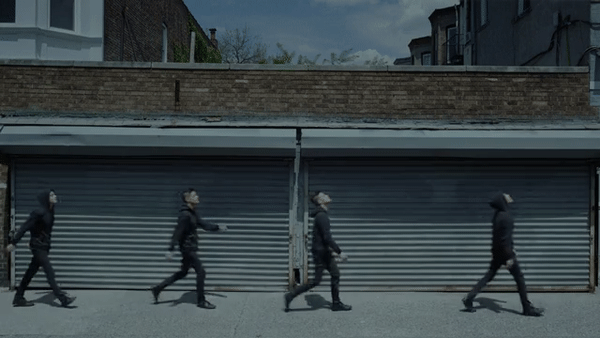 A scene with many Eliots skipping and gleefully walking in a scene from Mr. Robot.