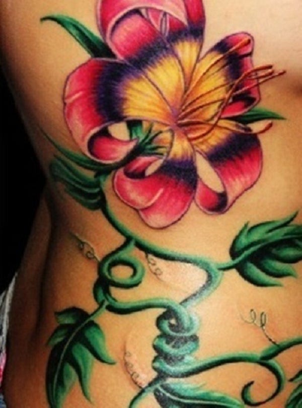 tropical flower leg tattoos