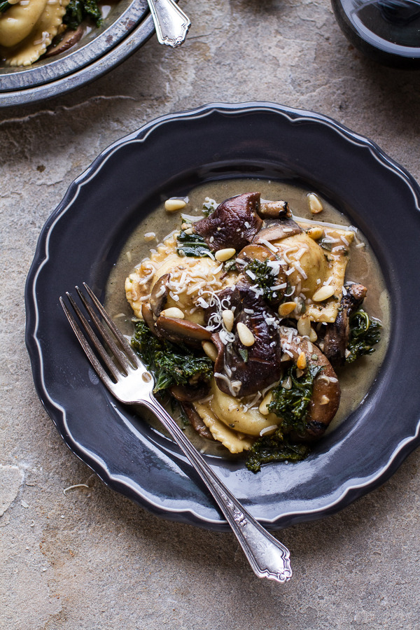 Taleggio Ravioli with Garlic-Butter Kale and Mushroom Sauce and Toasted Pine Nuts