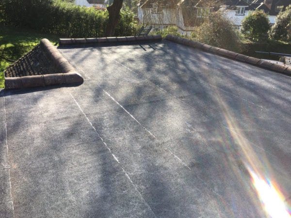 How To Lay Felt On a Flat Roof - RNS Roofing - Medium