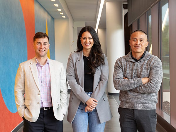 MBA students Brian Delamora, Namisha Ajit and Jake Gumarang