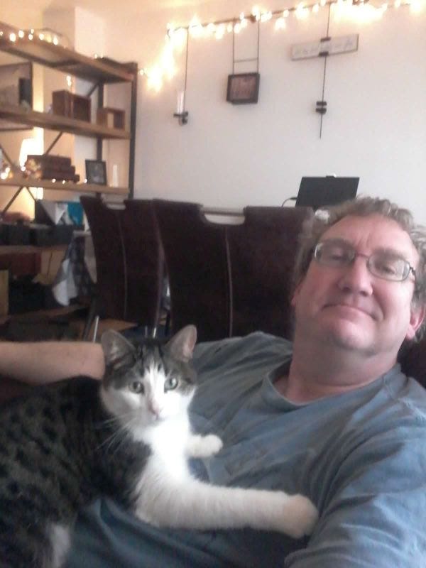 My beloved husband, with our cat Dapple in France in 2016