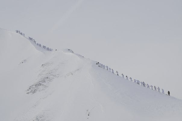 My platoon shortly before reaching a summit during our mountain warfare training winter.