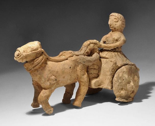 Rare Sumerian Two Solid Wheeled Chariot Figurine, 3rd-2nd ML BC, A ceramic model of a chariot comprising an advancing horse with bridle and reins, a small two-wheeled vehicle with lobes to the wheels and yoke, female rider with a full skirt and carefully dressed hair.