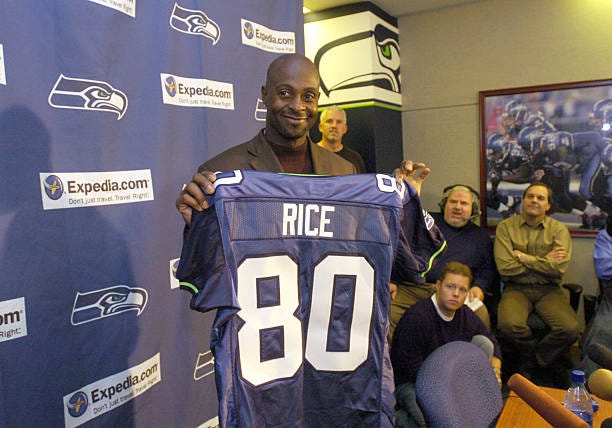 New Seattle Seahawks wide receiver Jerry Rice shows off his new jersey  Tuesday, Oct. 19, 2004 at Seahawks headquarters in Kirkland, Wash. The  Seahawks acquired Rice Tuesday from the Oakland Rainders and