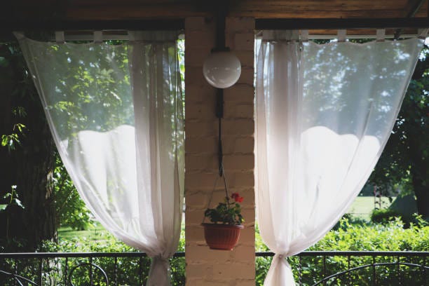 How To Keep Outdoor Curtains From Blowing In The Wind | by Wakeful Home |  Medium