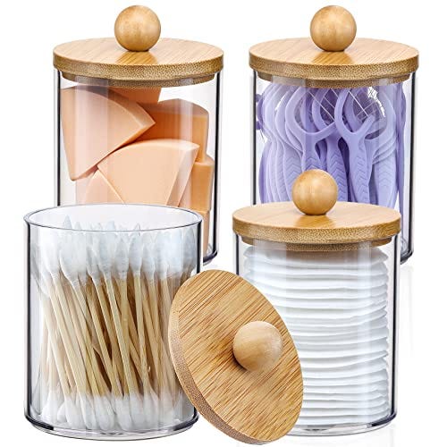 Toothbrushes and toothpaste neatly stored in glass jars, a stylish addition to your bathroom counter.