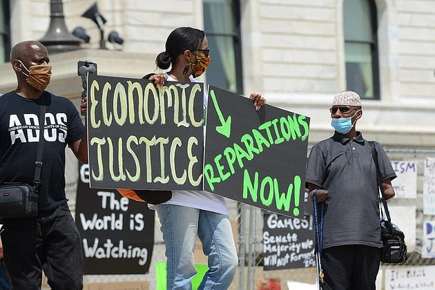 By Fibonacci Blue from Minnesota, USA — Juneteenth reparations rally to demand reparations from the United States government, CC BY 2.0, https://commons.wikimedia.org/w/index.php?curid=91361528
