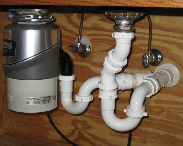 Double kitchen outlet sink plumbing