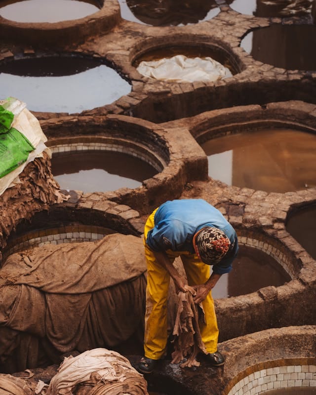 Traditional leather tanning in Morocco (Photo by Othmane Ettalbi via Pexels)