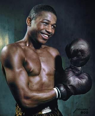A jarring, hair-raising right is thrown at Sugar Ray Robinson by