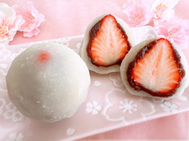 Japanese sweets called “Ichigo Daifuku,” soft rice cakes filled with sweet red bean paste and fresh strawberries.