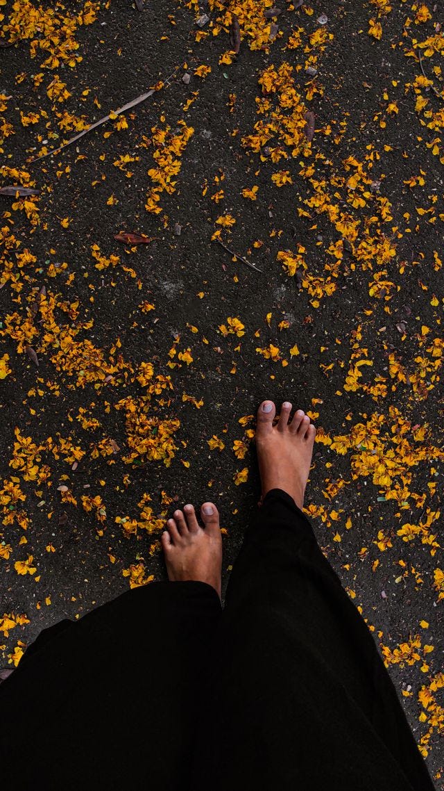 Before feet touch the ground.