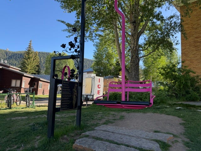 Left, the view from the lift/swing. A poem, and memorial lift/swing. Photos by the author.