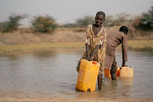 Fetching water into a cracked gallon.