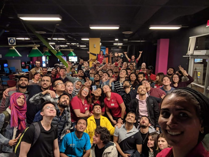 Group photo inside a gym.