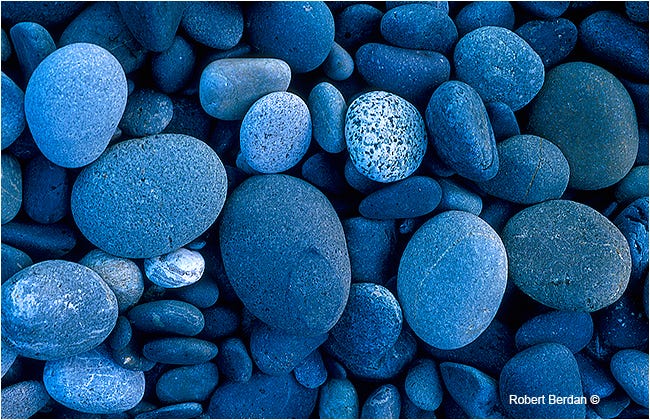 Similarity in photography. The picture “Stones on a beach” by… | by