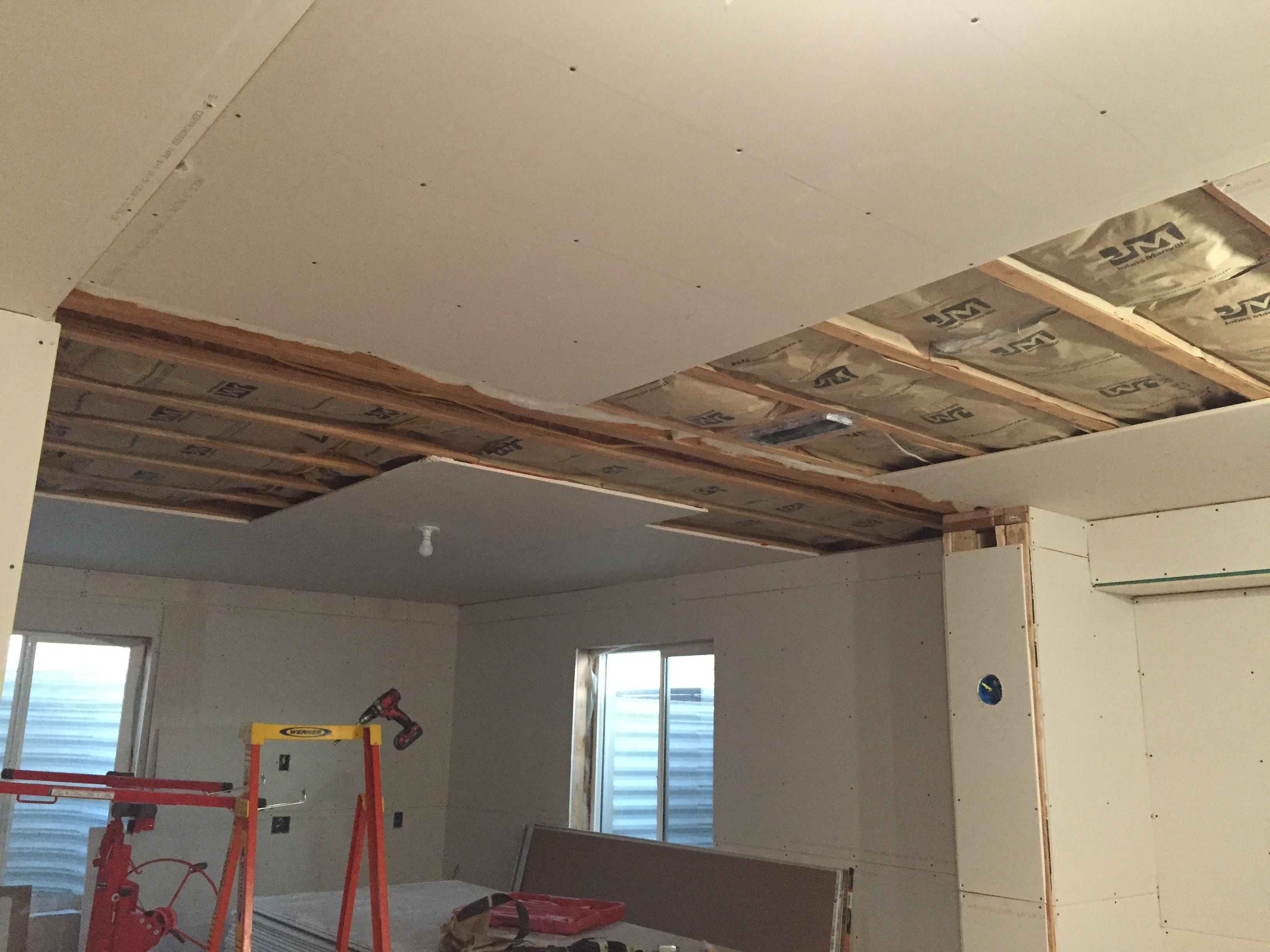 Drywalling the studio's outer wall — using double 5/8 drywall and Green  Glue, by Alexander Jenkins