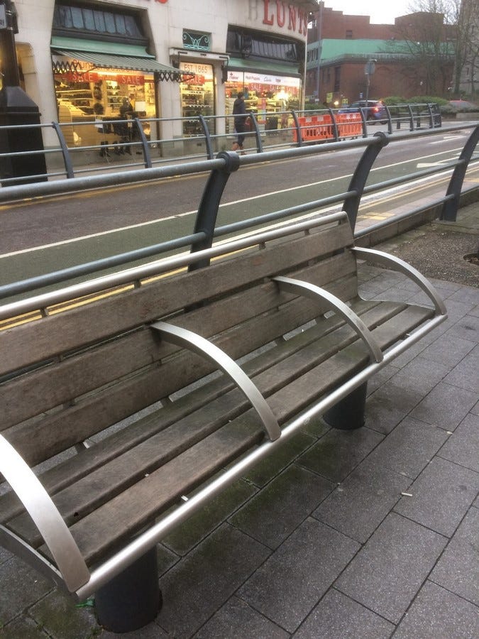 Sectioned bench, preventing homeless people from sleeping on it.