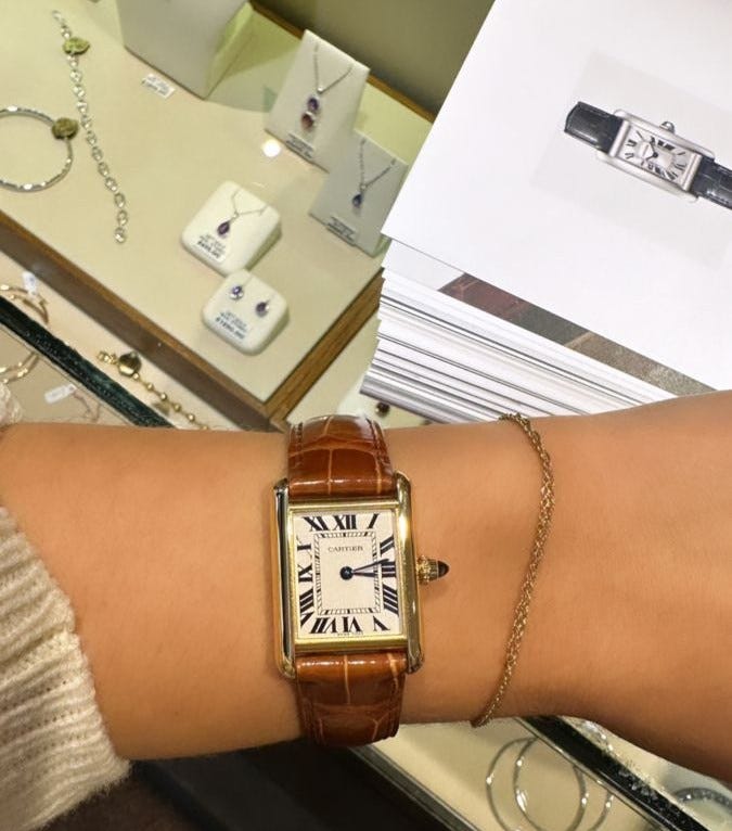Cartier Tank watch with rectangular design known for timeless elegance and iconic luxury style