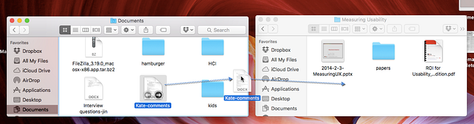 A screenshot of two Finder windows on a macOS system. The left window is open to the ‘Documents’ folder, displaying various files and folders, including ‘Kate-comments,’ which is highlighted and being dragged. The right window is open to the ‘Measuring Usability’ folder, showing files like ‘2014–2–3-MeasuringUX.pptx’ and ‘ROI for Usability…dition.pdf.’ A blue dashed arrow indicates that ‘Kate-comments’ is being moved from ‘Documents’ to ‘Measuring Usability.’